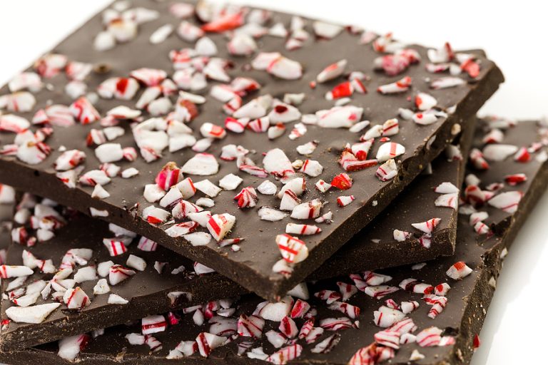 Close-up of homemade peppermint bark made with dark chocolate and crushed candy canes.