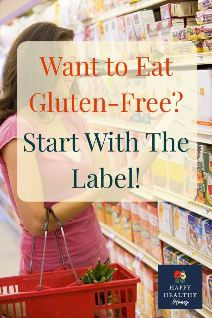 A woman reads a food label while grocery shopping, with text overlay: “Want to Eat Gluten-Free? Start With The Label!” — promoting a guide on how to read food labels for gluten.