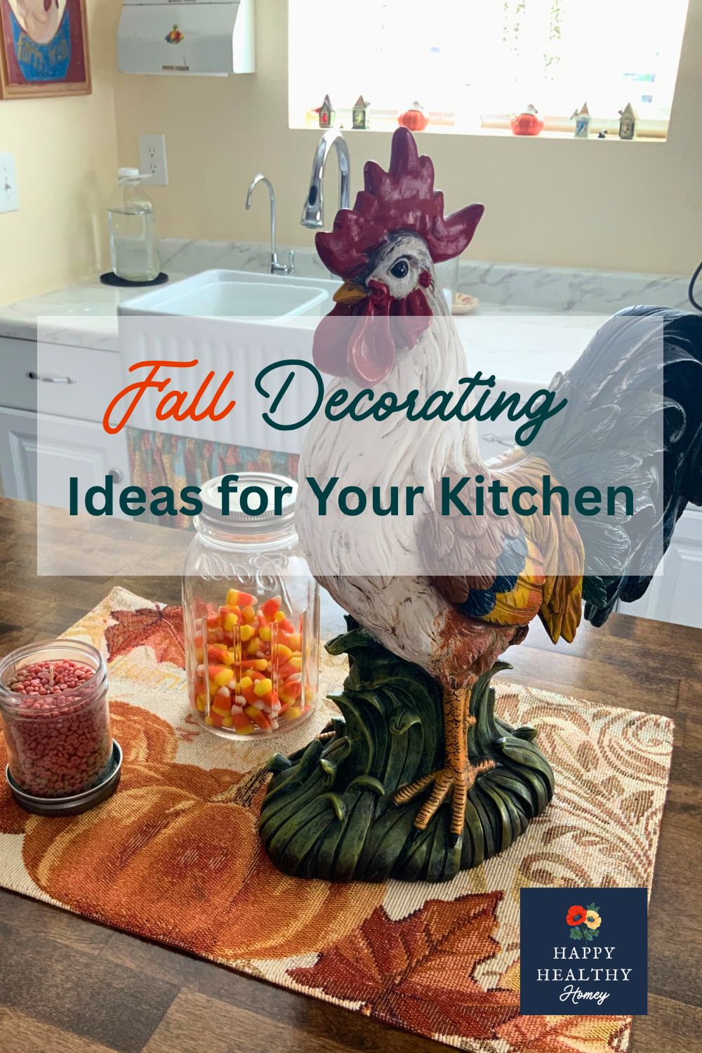 Ceramic rooster fall kitchen centerpiece on a pumpkin-themed placemat with candy corn and autumn decor in a cozy white farmhouse kitchen.