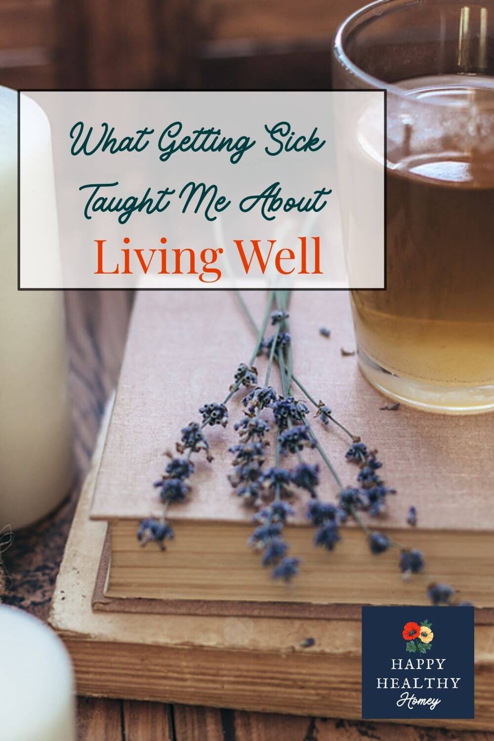 A warm cup of tea resting on stacked books with candles and lavender, representing rest, slowing down, and listening to your body.