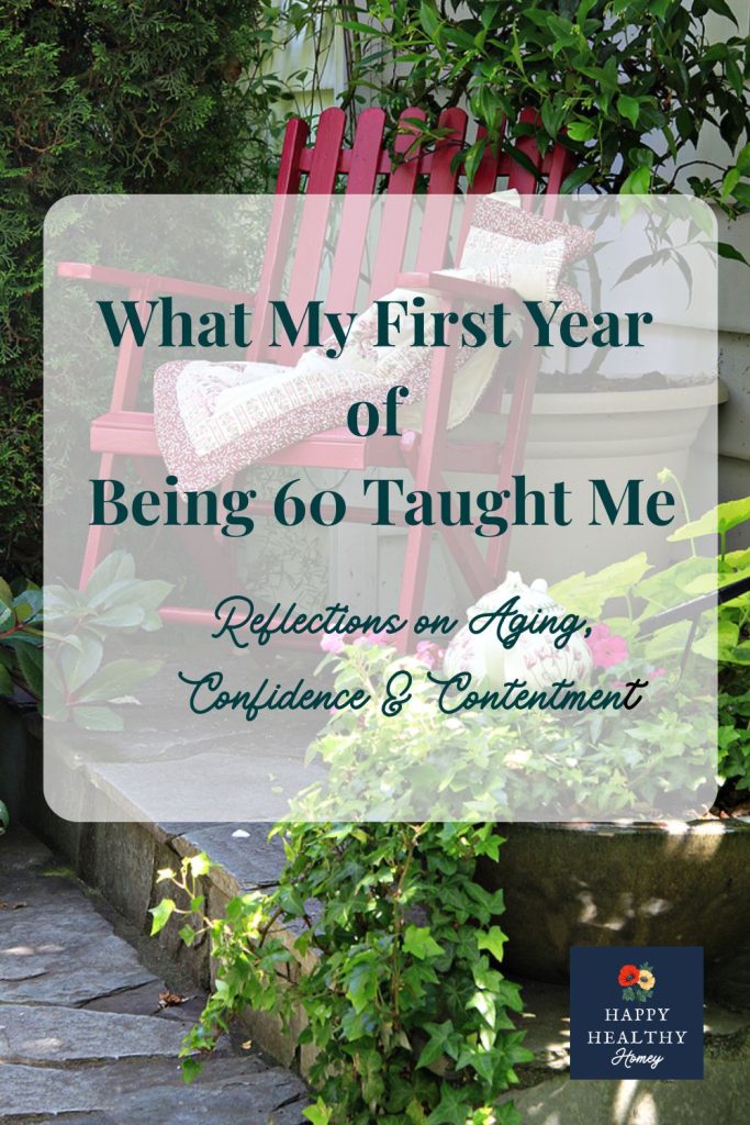 Red garden chair with quilt pillow in a peaceful garden setting with text overlay about reflections after a year of being 60.