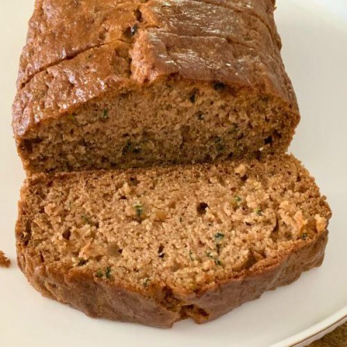 Slices of gluten-free Zucchini Bread on white plate.