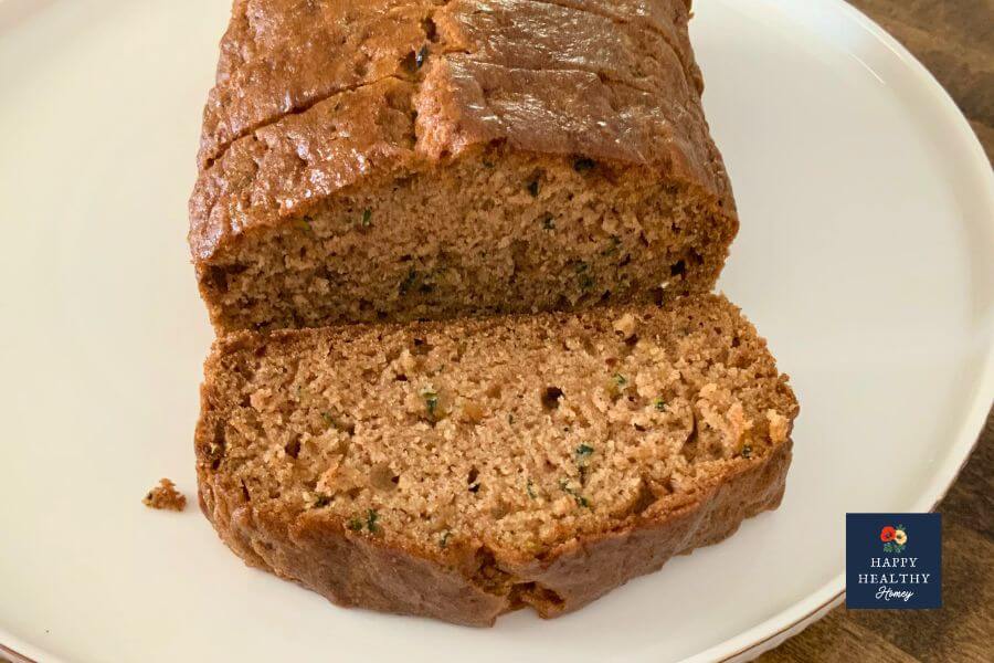 Slices of gluten-free zucchini bread on white plate.